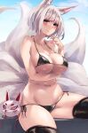  1girl alexi_oekaki animal_ears arm_under_breasts azur_lane big_breasts bikini black_bikini black_thighhighs blue_eyes blue_sky blush breasts cleavage closed_mouth fox_ears fox_girl fox_mask fox_tail high_res kaga_(azur_lane) looking_at_viewer mask micro_bikini multiple_tails navel outside side-tie_bikini_bottom sideboob sitting sky stockings swimsuit tail thighs under_boob unworn_mask 